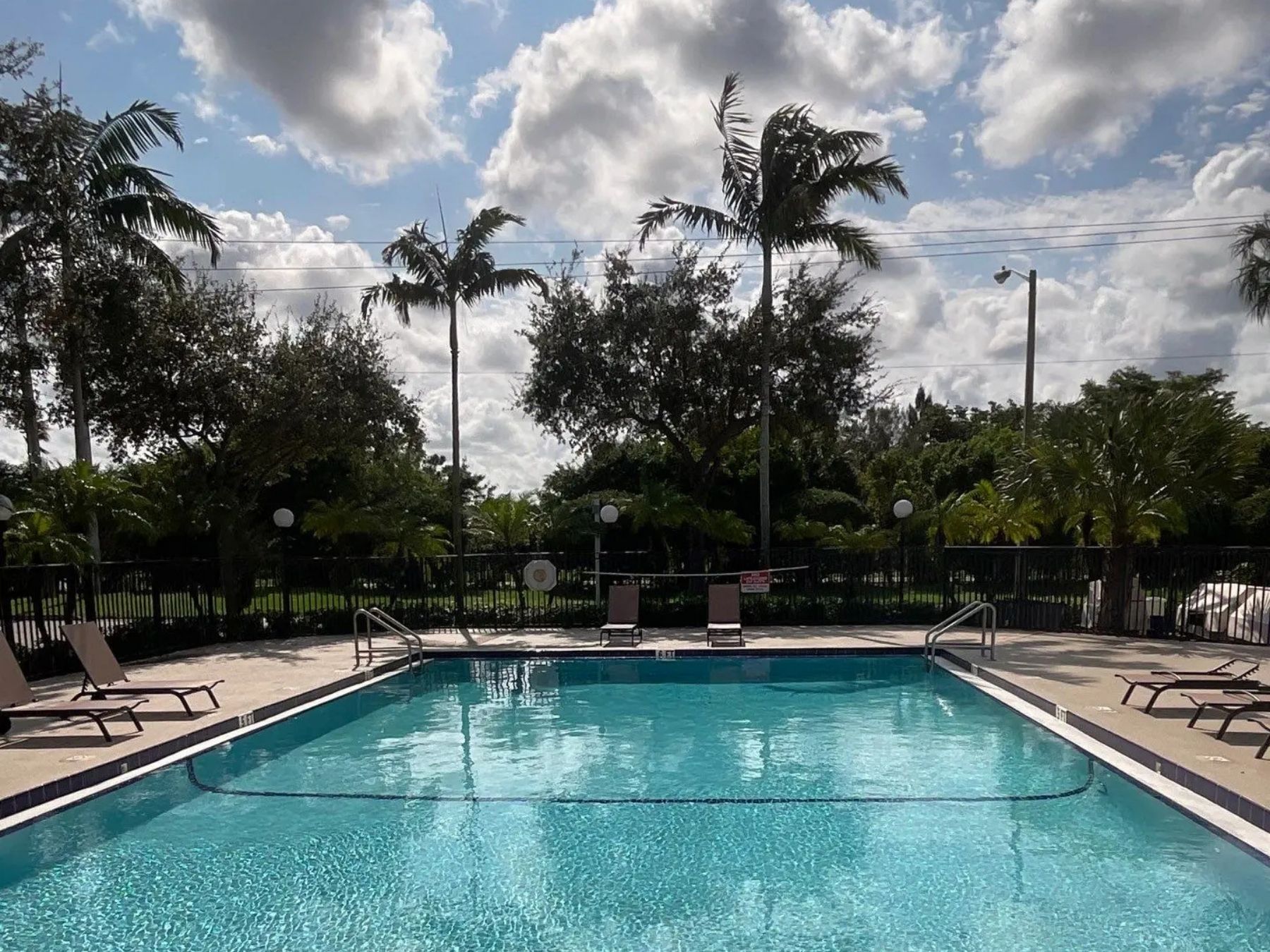 Swimming pool at single family home condominium in West Palm Beach, Florida