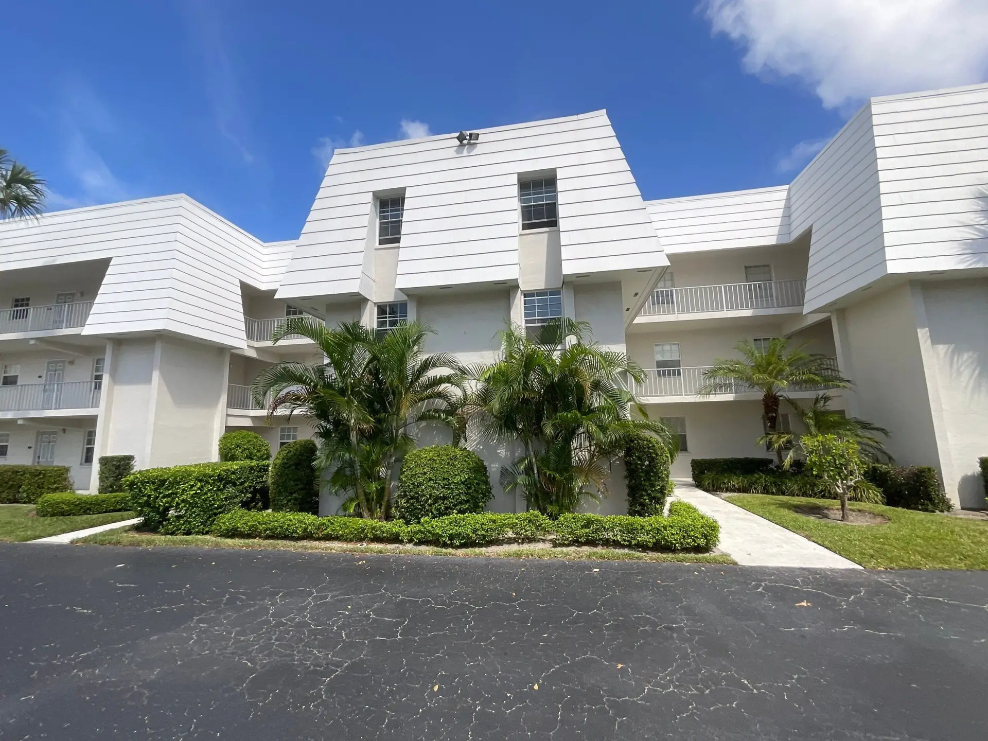Front entrance to condo building in West Palm Beach, FL